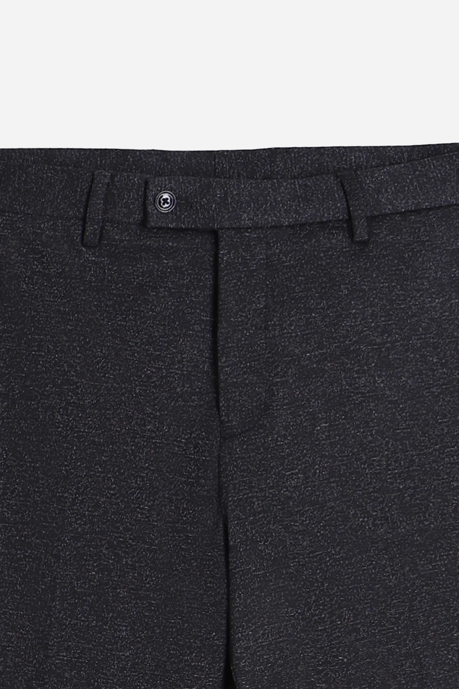 Dettaglio del tessuto punto Milano dei pantaloni neri