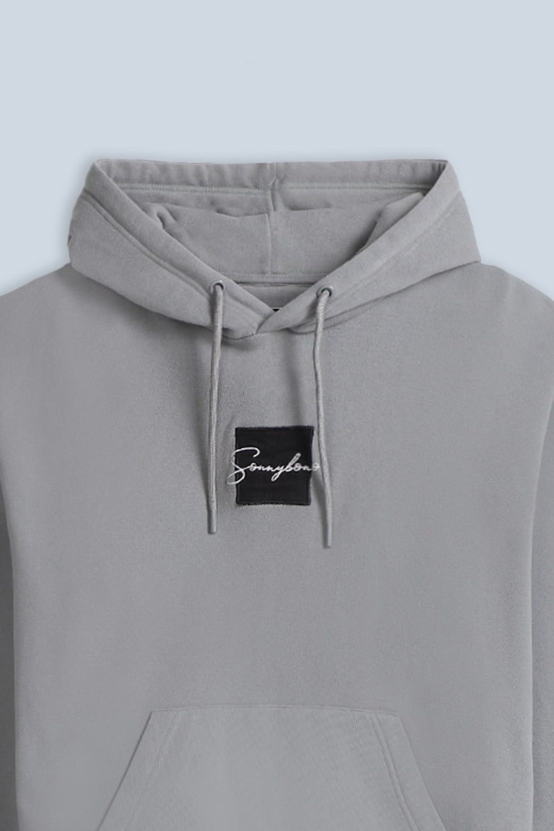 FELPA CON CAPPUCCIO E PATCH COMFORT FIT GRIGIO - Sonnybono