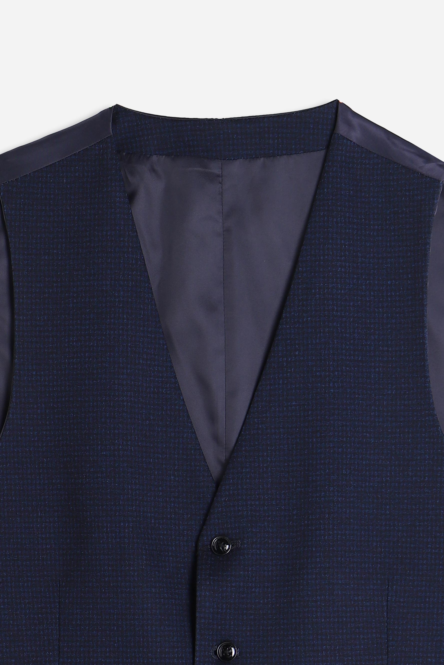 Dettaglio del tessuto punto Milano del gilet blu
